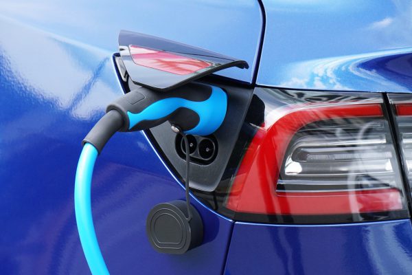 ev-or-electric-car-at-charging-station-with-plug-i-2021-08-29-01-11-11-utc-min