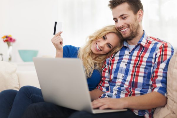 young-couple-paying-online-by-credit-card-2021-08-26-20-15-37-utc-min